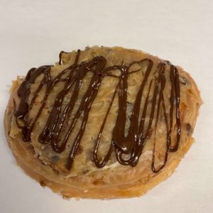 Glazed Fried Cinnamon German Chocolate Topped with Chocolate Drizzle Donut